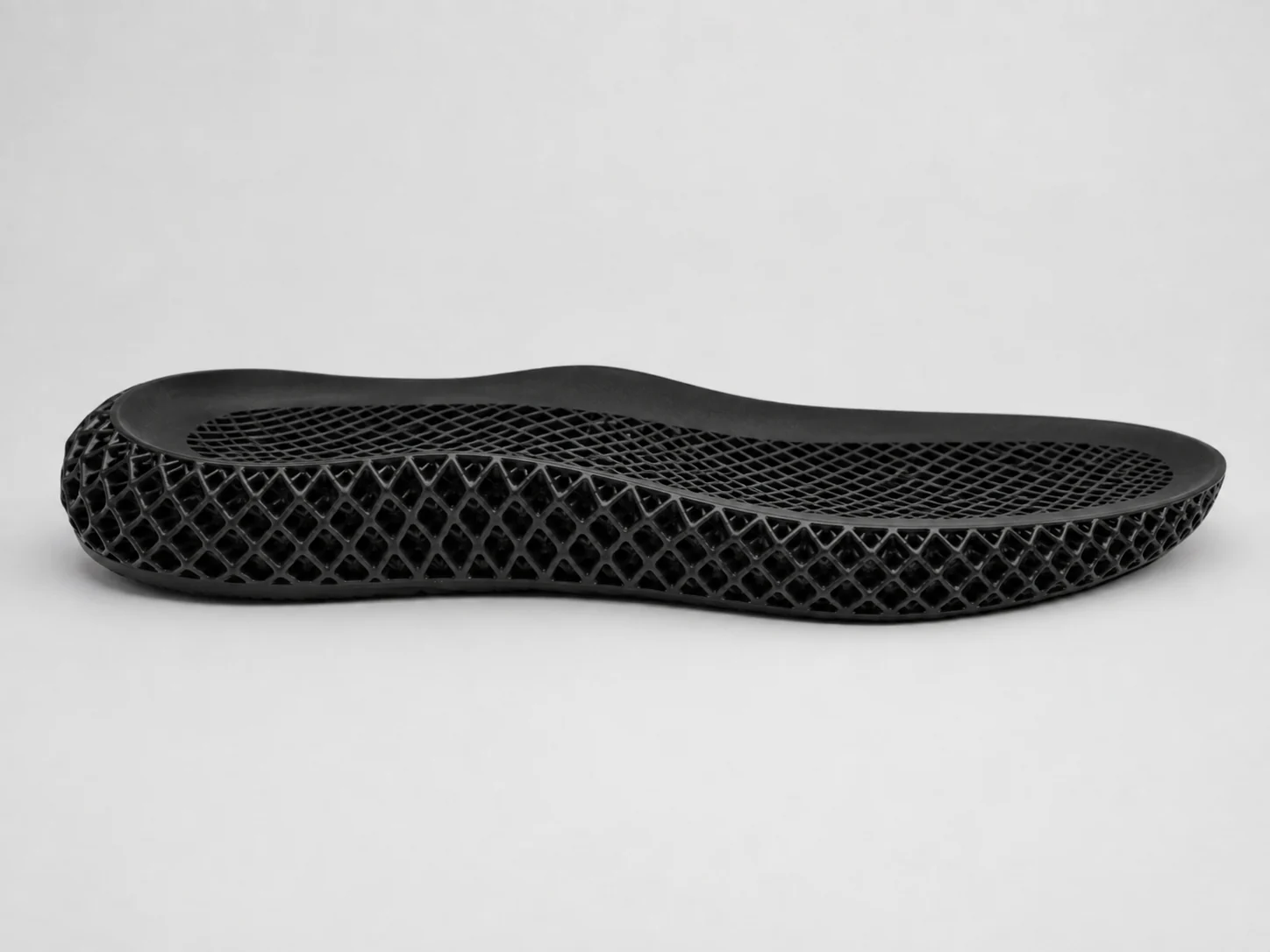 Custom black 3D printed lattice shoe sole by Huadong Soles